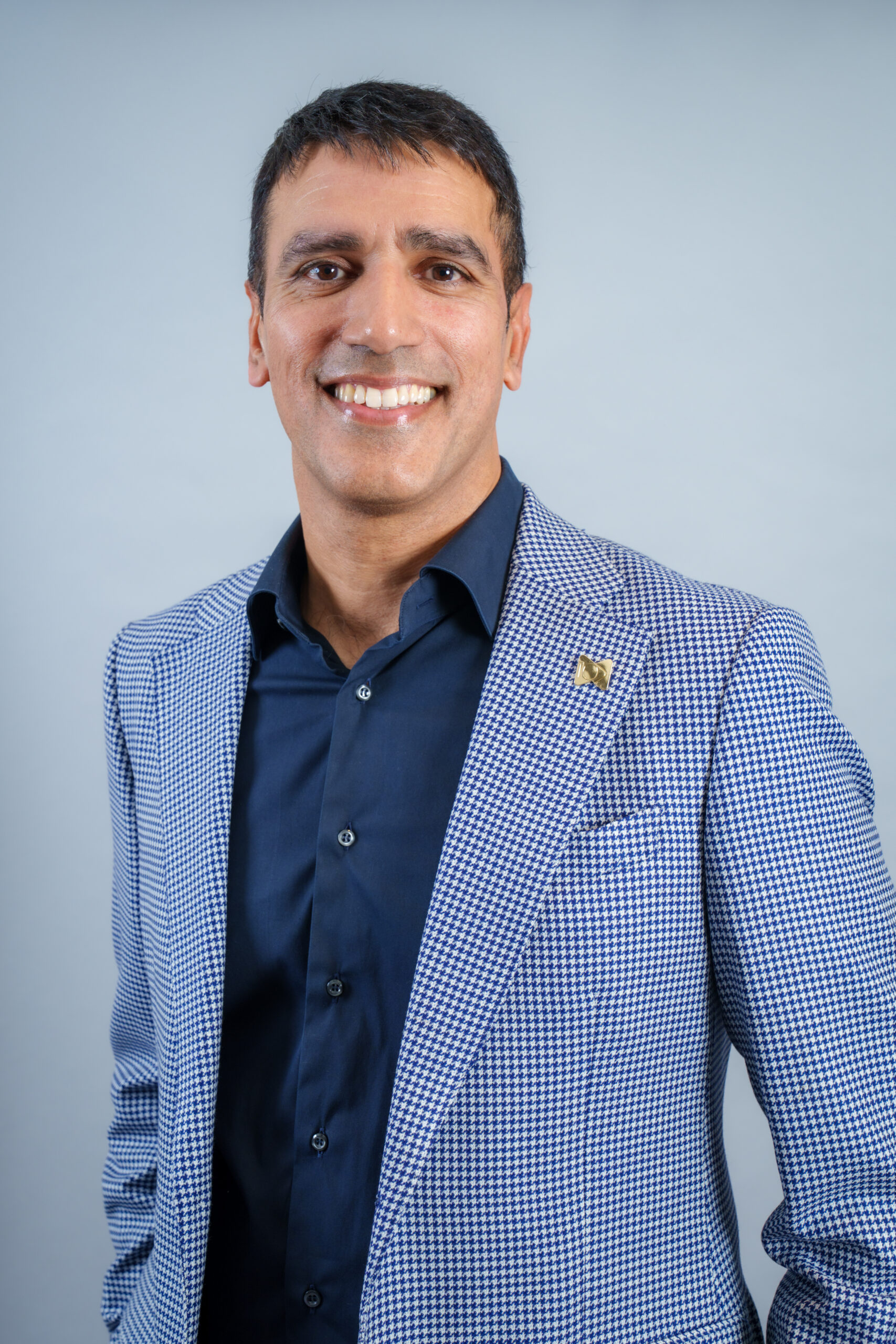 Dr Patel posing for a professional picture